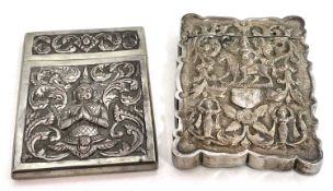 Two Burmese white metal card cases with figural embossed decoration, 190gms (2)