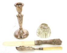 A silver bladed butter knife, Birmingham 1879, and a further silver mounted inkwell and a silver