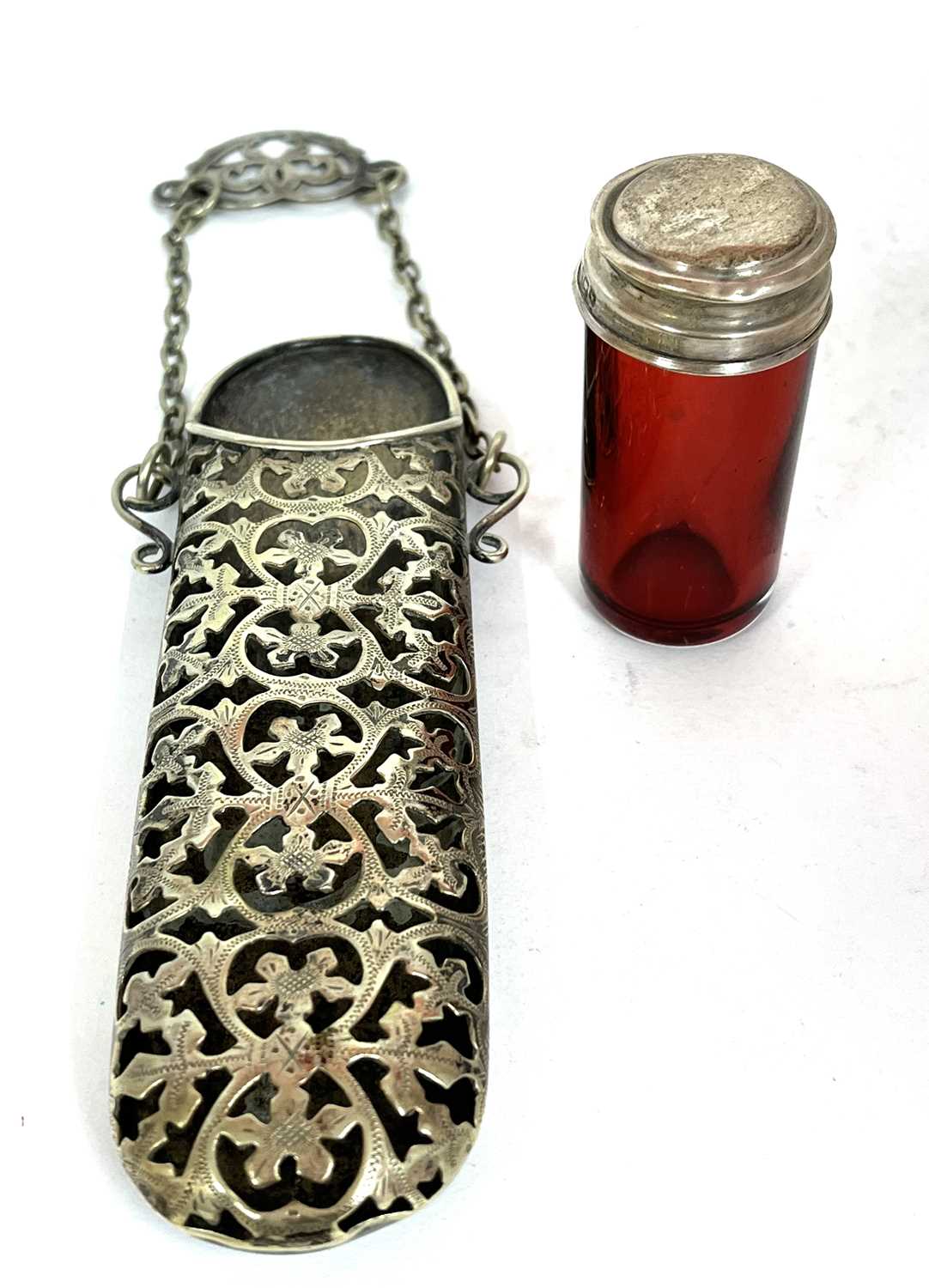 Mixed Lot: A cranberry glass cylinder jar with pull off silver lid (a/f), together with a vintage