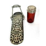Mixed Lot: A cranberry glass cylinder jar with pull off silver lid (a/f), together with a vintage