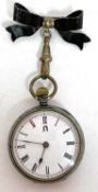 A ladies Omega metal pocket watch with bow pin, it has a manually crown wound movement, the inside