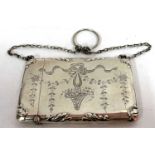 A Edward VII silver card case engraved with a ribbon tie and basket of flowers, chain and ringlet