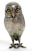 An antique silver plated owl pepper naturalistically modelled as a perched owl, decorated with