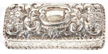 Late Victorian silver trinket box of rectangular form, the hinged lid with a slight dome shape,