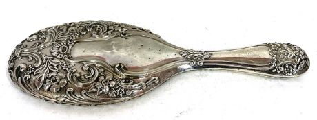 Edwardian silver back dressing table mirror elaborately embossed with flowers, scrolls etc,