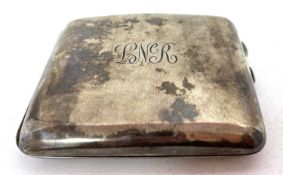 A George V silver cigarette case of slight curved plain polished form engraved with initials,