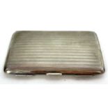 A George V silver card case with engine turned line decoration, Birmingham 1910, makers mark for