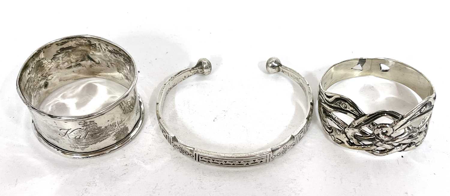 Mixed Lot: A white metal torque bracelet, stamped 925 together two hallmarked silver serviette - Image 2 of 2