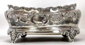 A Victorian silver cruet base of oval form with gadrooned wavey rim, embossed with floral and