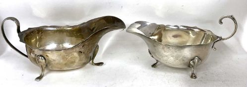 Two hallmarked silver sauce boats of typical form, Sheffield 1939 and Birmingham 1941, 241.6gms
