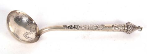 North African white metal ladle with engraved circular bowl chased hollow handle and pointed finial,