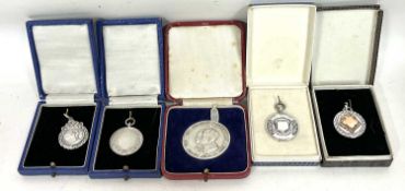 Mixed Lot: Three hallmarked silver fobs (without engraving), a swimming medallion stamped silver