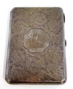 An Edwardian silver card case, overall engraved with scrolls around a monogram, fitted interior,
