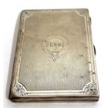 A Victorian card case with bright cut engine turned decoration around a monogram, fitted interior,