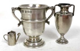 Mixed lot to include a miniature Edwardian silver twin handled trophy, 1903, 4cm tall, a twin