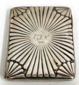 A Victorian card case with radial embossed decoration, the full length spring hinge opening to a