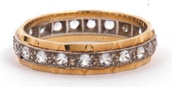 18ct gold full eternity ring set with twenty small single cut diamonds (one diamond missing),