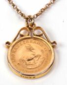 A 10th ounce Krugerrand gold coin dated 1980 in a 9ct gold pendant mount suspended from a 9ct chain,
