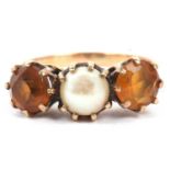 9ct gold citrine and pearl three stone ring centering a small cultured pearl flanked by two round