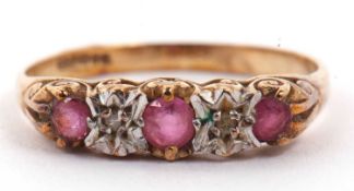 9ct gold ruby and diamond ring featuring three small graduated round cut rubies highlighted