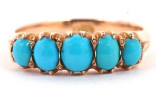 A vintage five stone turquoise ring featuring five graduated oval cut cabochon turquoises,