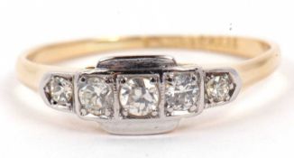 An Art Deco five stone diamond ring featuring five small graduated round cut brilliant diamonds,