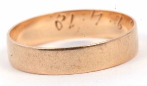 Yellow metal wedding ring of plain polished design engraved inside with a D.B 2.4.18, tests 9ct