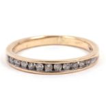 Modern diamond half eternity ring chanel set with twelve small round single cut diamonds and stamped