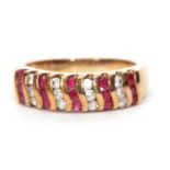 Modern 9ct gold cubic zirconia set ring, alternate design with bands of red stones and cubic