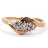9ct gold and diamond crossover ring centering a round brilliant cut diamond of 0.15ct approx, raised
