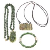 A mixed lot to include vintage green glass hinged bracelet, a modern jade moth pendant on a 585
