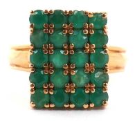 Emerald tablet ring, the rectangular panel is 16 x 12 mm, set with twenty small round cut emeralds
