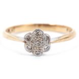 Vintage small diamond cluster ring featuring seven small diamonds in illusion setting, stamped 9ct