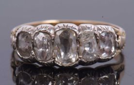 Antique old brilliant cut diamond five stone ring featurning five graduated oblong shaped