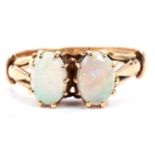 Opal two stone ring featuring two oval cabochon cut opals individually multi claw set and raised