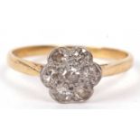 Antique diamond cluster ring, a flower head design featuring seven small single cut diamonds,