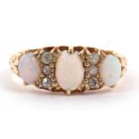 Antique 18ct gold opal and diamond ring featuring three graduated oval cabochon cut opals,