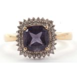 Modern 9ct gold iolite and small diamond cluster ring, the square shaped centre stone raised above a