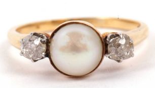 A pearl and diamond three stone ring, the centre pearl is 8mm diameter flanked by two old cut