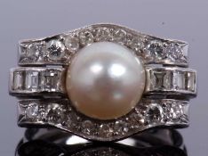 Precious metal pearl and diamond cocktail ring centering a cultured pearl (8mm diameter), raised