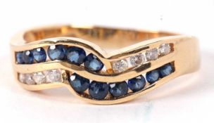 A 14ct sapphire and diamond ring, the two strand crossover style ring set with small round sapphires