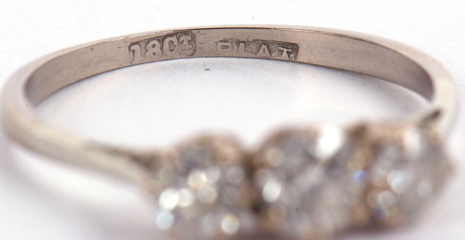 An 18ct white gold three stone diamond ring, the three round brillinat cut diamonds, total estimated - Image 8 of 9