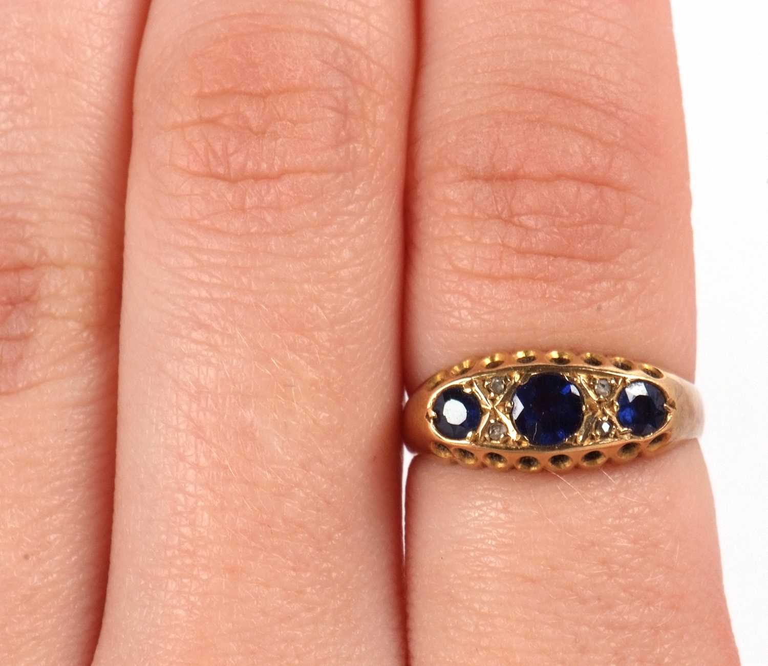 An 18ct sapphire and diamond ring, the three round sapphires set with diamond highlights, with - Image 8 of 8