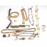 A quantity of costume jewellery to include faux pearls, gilt chains, earrings, marcasite, a