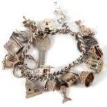 A silver and white metal charm bracelet, with an assortment of marked and unmarked charms, 69g