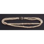 A faux pearl necklace, a twin row of uniform pearls, 6.50 mm diameter to a sterling silver and