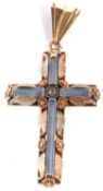 A blue synthetic spinel cross pendant, set with a single white stone to centre, all mounted in tri-