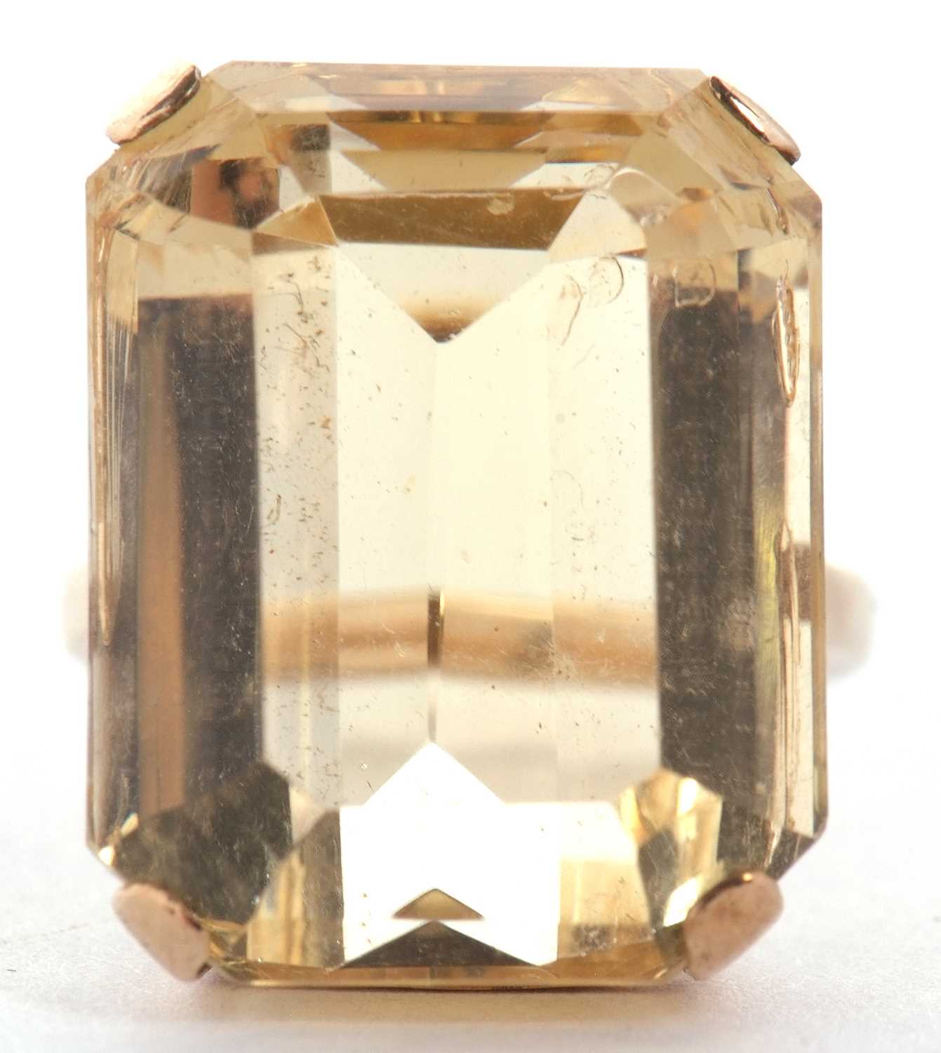 A 9ct citrine ring, the emerald cut citrine, approx. 21 x 16 x 12mm, in a four claw mount and