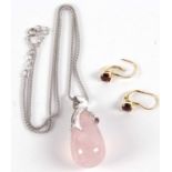 A rose quartz silver necklace, the pear shape rose quartz pendant with fitted silver cap and pale