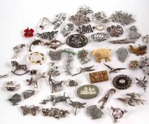 A large quantity of silver and white metal brooches, in 3 boxes